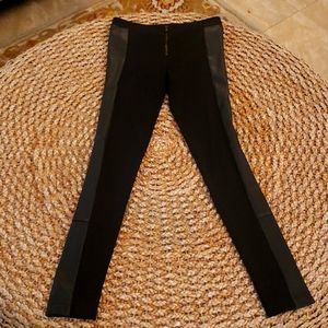 Alice+Olivia. Black leggings with leather side panels.